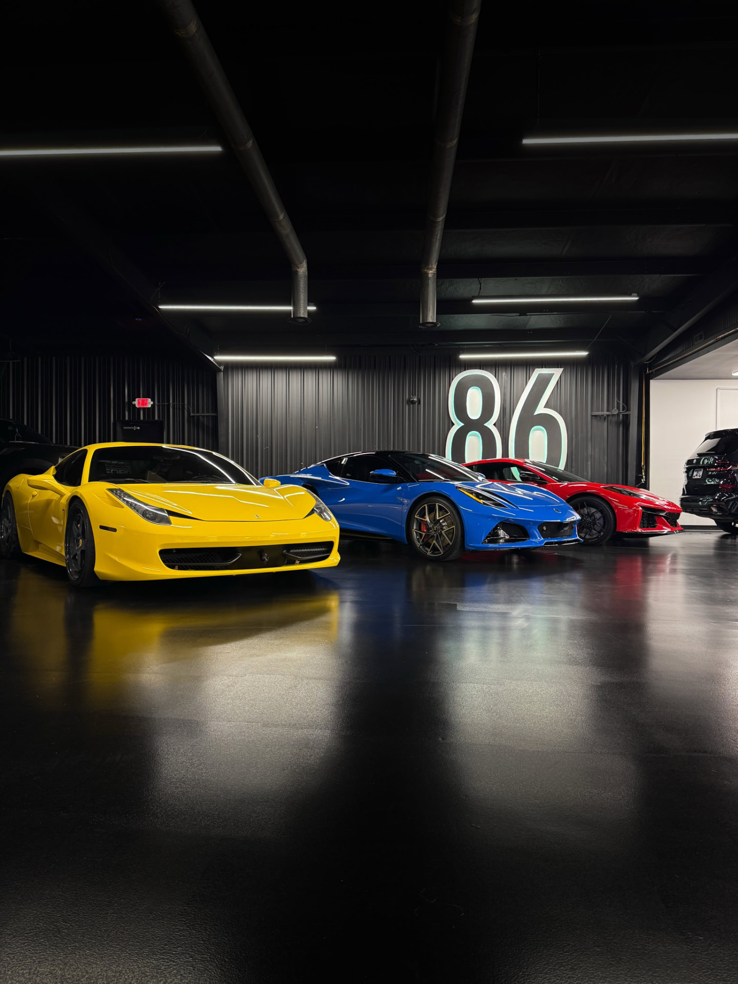 Exotic cars with paint protection film inside the 86 Auto Lab studio in Gallatin